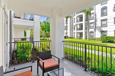 a balcony with a chair and a building at 4012 Breakview Drive 110 in Orlando