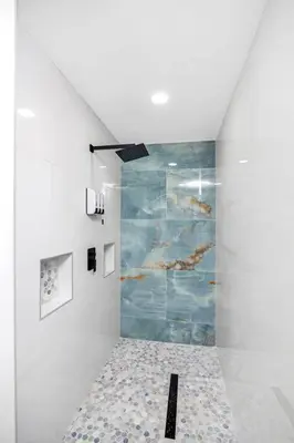a white hallway with a painting on the wall at Home away from home in Orlando! in Orlando