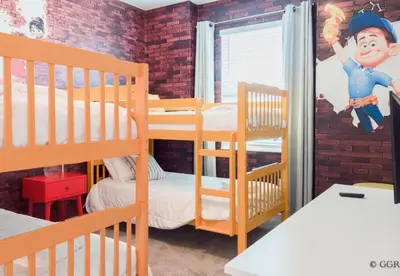 a room with two bunk beds and a window at 4577 Stunning 7 bedroom home in Kissimmee
