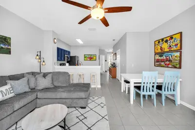 a living room with a couch and a table at Townhome near Disney with pool Magic and Fun at Windsor in Orlando