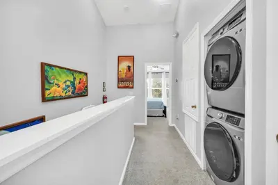 a laundry room with a washer and dryer at Townhome near Disney with pool Magic and Fun at Windsor in Orlando