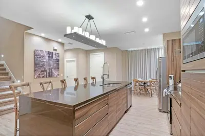 a kitchen with a large island in the middle at Beautiful 4 suites - Close to Disney 7505 in Orlando
