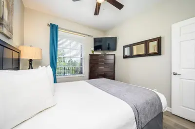 a bedroom with a white bed and a window at Epic Universe Beautiful Condo, Vista Cay, Orlando-3026 in Orlando