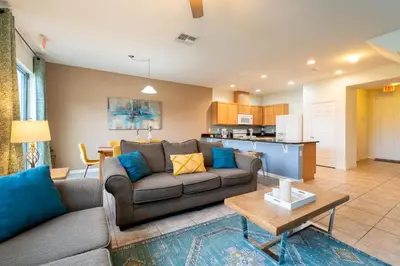 a living room with a couch and a table at Compass Point Villa S in Kissimmee