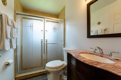 a bathroom with a toilet and a sink and a shower at Eagle's End S in Kissimmee