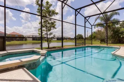 a swimming pool with a view of the water at 6 bedrooms pool home Gated resort Veranda Palms in Kissimmee