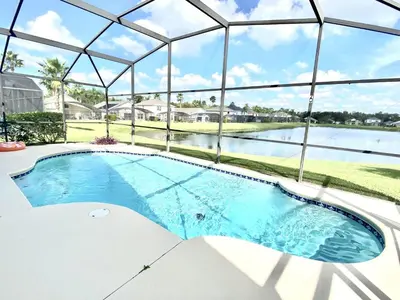 a swimming pool in a house with a glass ceiling at LB4707AW 3 Bedroom Villa with pool and game room in Kissimmee