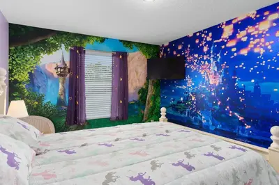 a bedroom with a bed with a disney wall mural at Lakeview w/8 Bedroom 5 KingSuite 3 miles to Disney in Kissimmee
