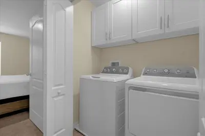 a white laundry room with a washer and dryer at 3BD townhome near Disney 4730 in Kissimmee