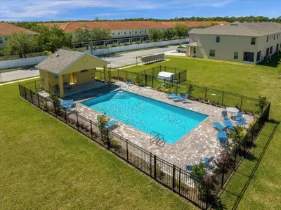 an overhead view of a swimming pool in a yard at 3BD townhome near Disney 4730 in Kissimmee