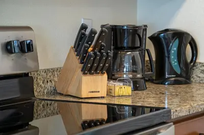 a kitchen counter with a knife block and a blender at Pool Townhouse near to Disney - Bella Vida Resort in Kissimmee