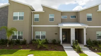 a large house with at Gorgeous 4 Bedroom w Screened Pool Close to Disney 2653 in Kissimmee