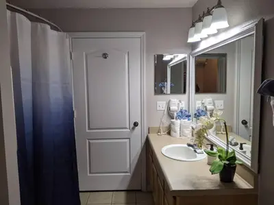 a bathroom with a sink and a mirror at Nice & Cozy - Vacation Home in Kissimmee