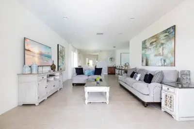 a living room with a couch and a table at Fantabulous Disney Vacation House in Orlando