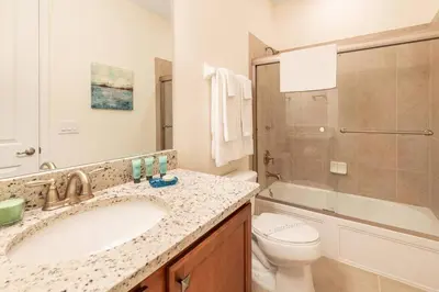 a bathroom with a sink and a toilet at Fantabulous Disney Vacation House in Orlando