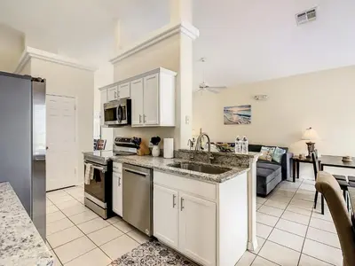 a kitchen with a sink and a counter top at Family pool home near Disney wBBQ grill in Orlando