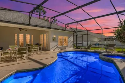 a swimming pool in a house with a roof at The Marvel Mansion 5BR Pool Home Near Disney World in Orlando