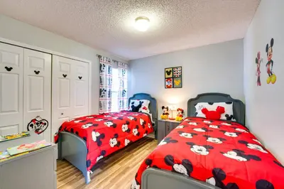 a childs bedroom with two beds with cows on them at Kissimmee Vacation Rental - 5 Mi to Disney World! in Kissimmee