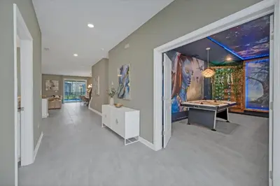 a large room with a pool table in it at 9 Bedrooms 5 Bathrooms Storey Lake 2854 Bd in Kissimmee