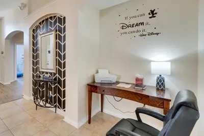 an office with a desk and a mirror at Kissimmee Vacation Rental with Pool about 4 Mi to Disney in Kissimmee