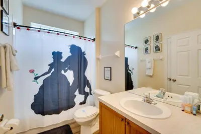 a bathroom with a sink and a toilet and a shower curtain at Kissimmee Vacation Rental with Pool about 4 Mi to Disney in Kissimmee
