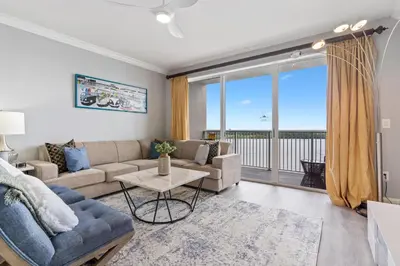 a living room with a couch and a table at Blue Heron Beach Resort in Orlando