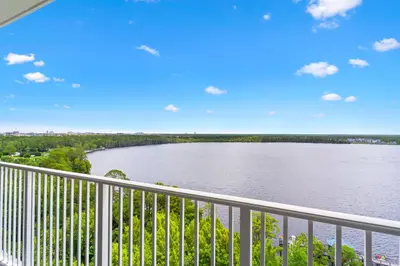 a view of a lake from a balcony at Blue Heron Beach Resort in Orlando