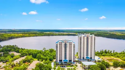 an aerial view of two tall buildings next to a river at Blue Heron Beach Resort in Orlando