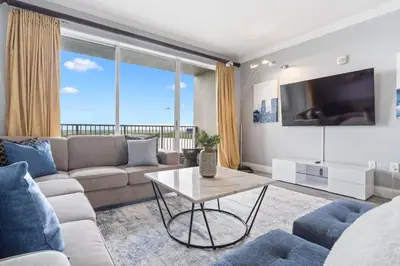 a living room with a couch and a table at Blue Heron Beach Resort in Orlando