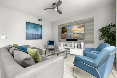 a living room with two couches and a tv at Magic Condo 3BR at Storey Lake – 10 min to Disney in Kissimmee