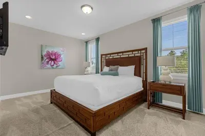 a bedroom with a large bed and a window at Multiple Family Homes - 23 Rooms PoolsSpas in Orlando