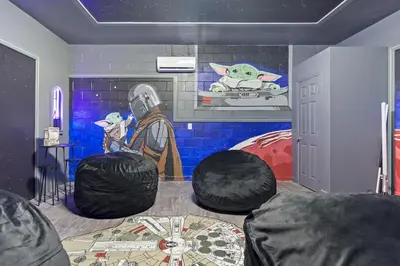 a room with a star wars room with a painting at The Pink House at Windsor Hills in Orlando
