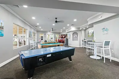 a billiard room with a pool table and a bar at The Pink House at Windsor Hills in Orlando