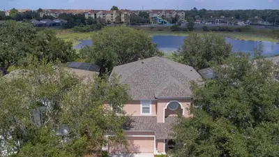 an aerial view of a house with trees at The Pink House at Windsor Hills in Orlando
