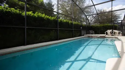 a large swimming pool with a fence at Just Wanna Have Sun! in Orlando
