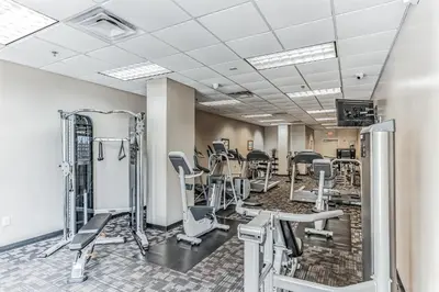 a fitness room with treadmills and exercise equipment at Pirate Ship Resort Condo in Orlando