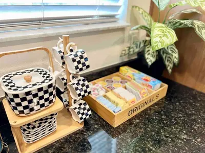a table with a box of food and a basket of cookies at AMAZING vacation house .Mins to Disney Regal oasks in Orlando
