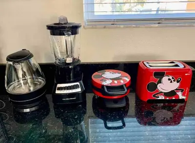 a counter with a blender and a toaster on it at Find your Cozy home 8 minutes near Disney and Universal in Orlando
