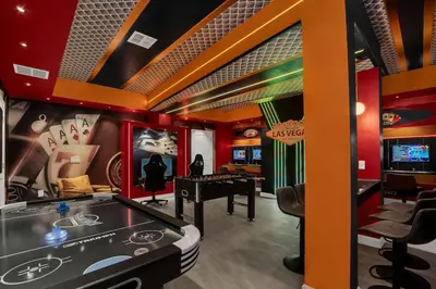 a room with a ping pong table and a game room at Perfect Disney Vacation Home in Kissimmee
