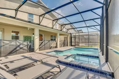 an indoor swimming pool with a glass ceiling at Perfect Disney Vacation Home in Kissimmee
