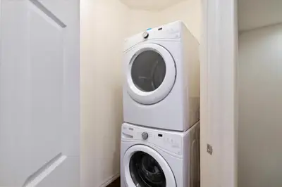 a washing machine and a washer in a room at 43 Townhouse Near Disney!! in Kissimmee