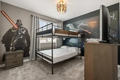 a bedroom with a bunk bed with a star wars mural at Upstay Modern 5BR Resort Home w Pool & Hot Tub in Kissimmee