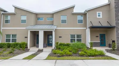 a large building with a driveway in front of it at 2941 Modern Four Bedroom Locate at Storey Lake in Kissimmee
