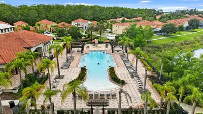 an aerial view of a pool at a resort at Family Retreat 6BR Villa with Private Pool, Spa & Theater near Disney in Kissimmee