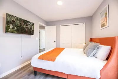 a bedroom with a large bed in a room at Family Retreat 6BR Villa with Private Pool, Spa & Theater near Disney in Kissimmee
