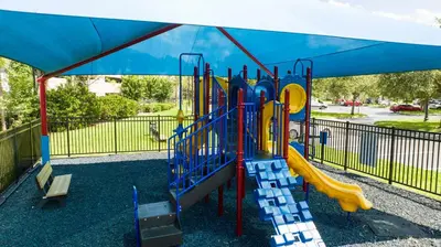 a playground with a slide in a park at Location Location Orlando Resort Near All Parks! Int'l Dr in Orlando