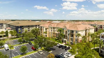 an aerial view of a parking lot at a apartment complex at Location Location Orlando Resort Near All Parks! Int'l Dr in Orlando
