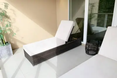 two white chairs sitting on a porch at Luxury Townhouse located NEXT to DISNEY ORLANDO in Orlando