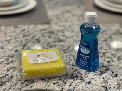 a blue bottle of mouthwash and a butter on a counter at bsv_villa8445 in Kissimmee