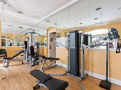 a gym with several exercise equipment in a room at bsv_villa8445 in Kissimmee